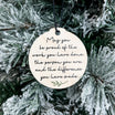 Round decorative tag with motivational quote on a frosted branch